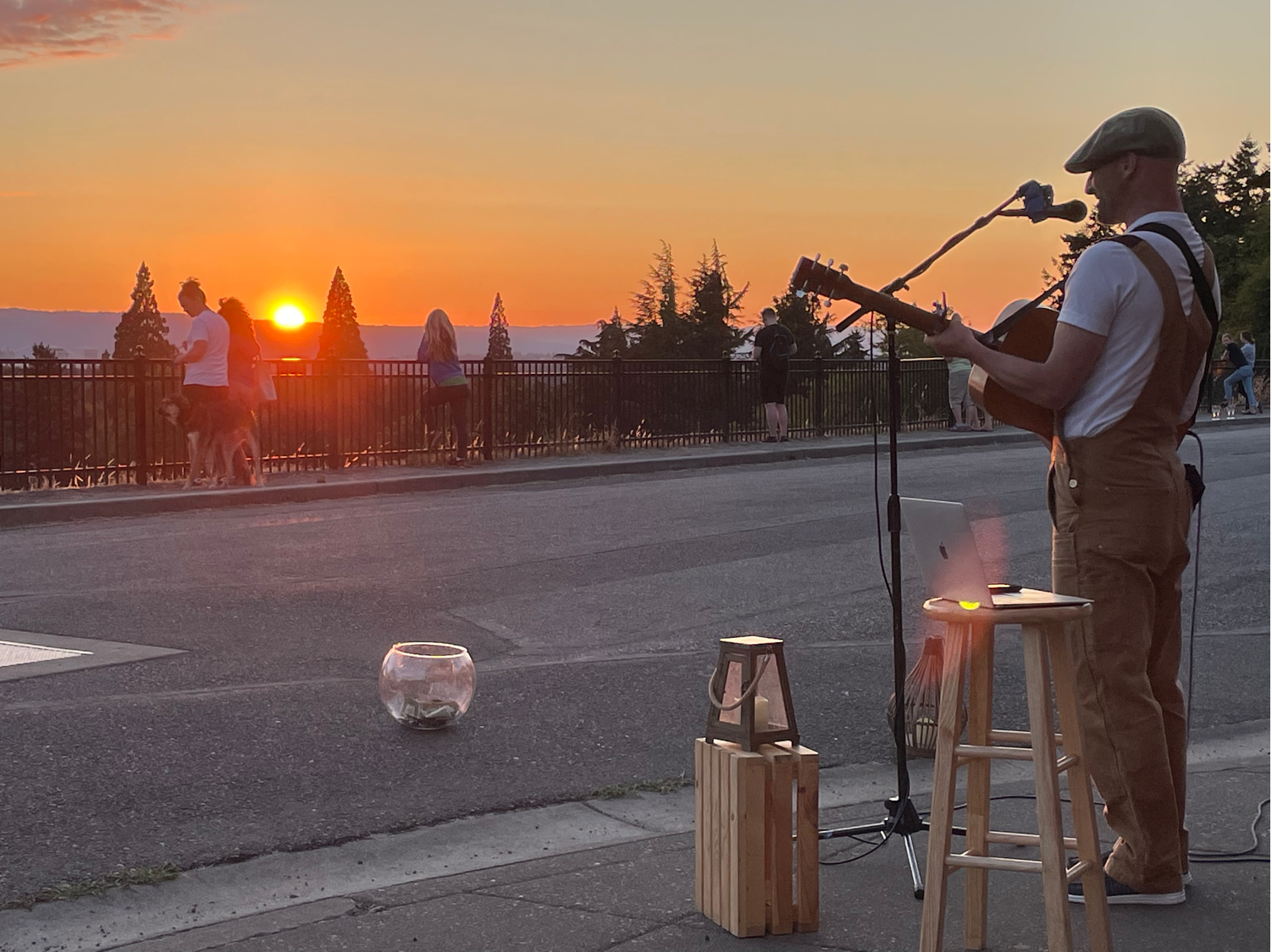 Michael Myers playing guitar watching the sun set 