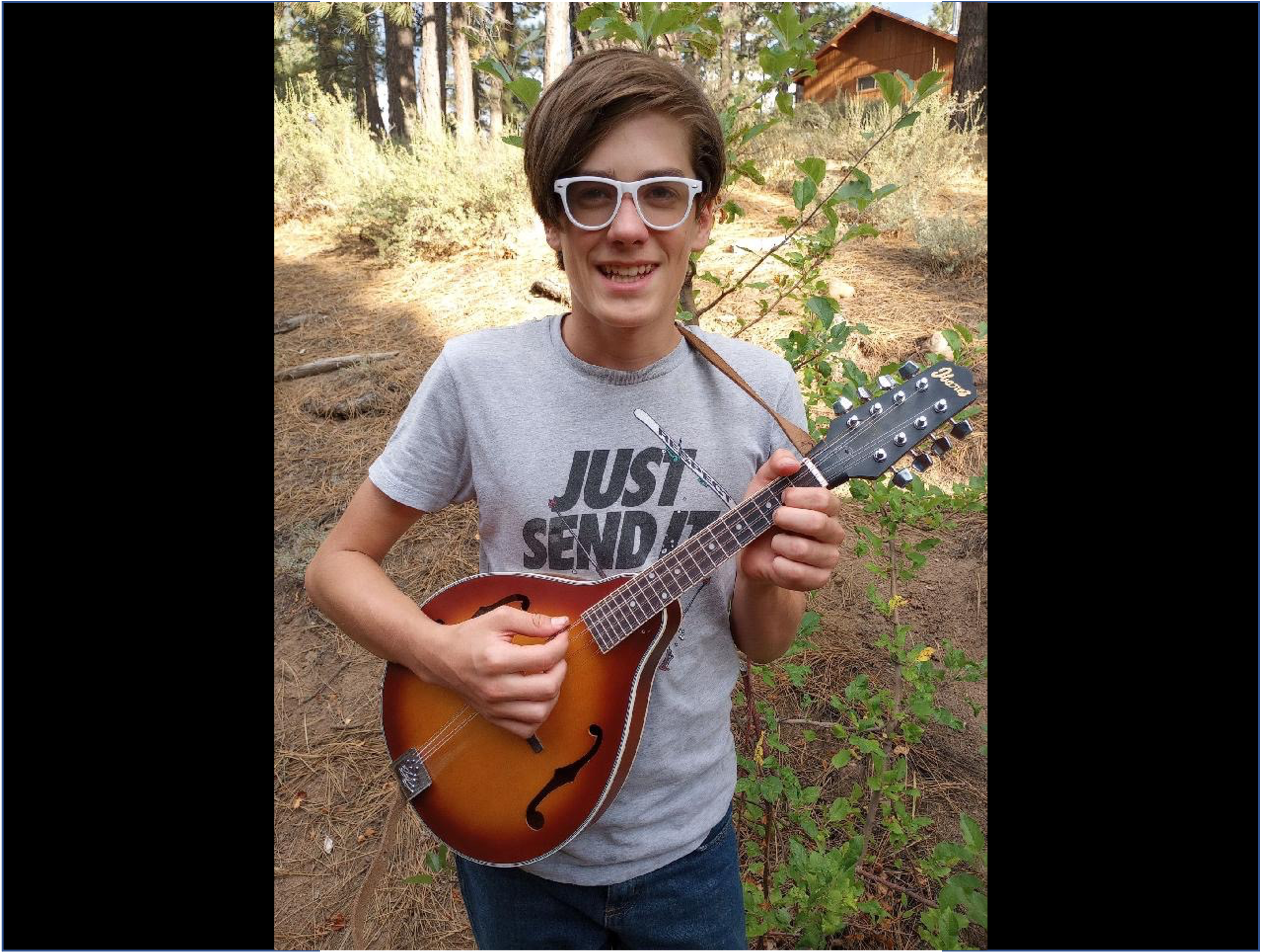 Everett Seal playing mandolin